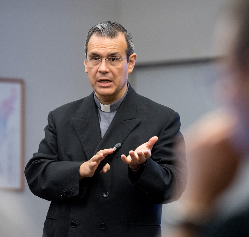 Father Rafael teaching